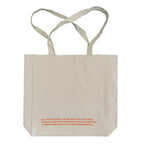 Beige tote bag with orange text on a white background